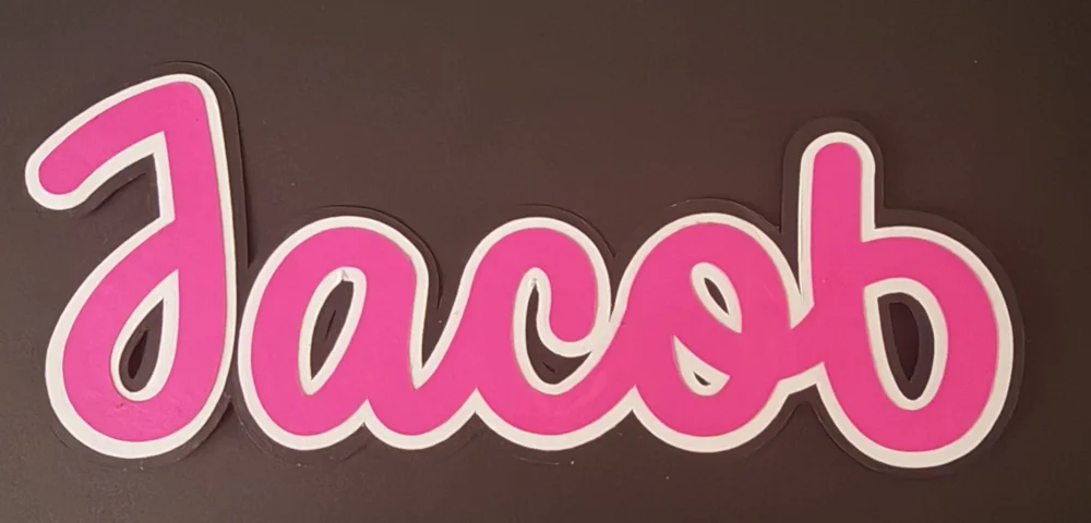Three-layer name reading Jacob in pink, with a white layer and a black layer behind it